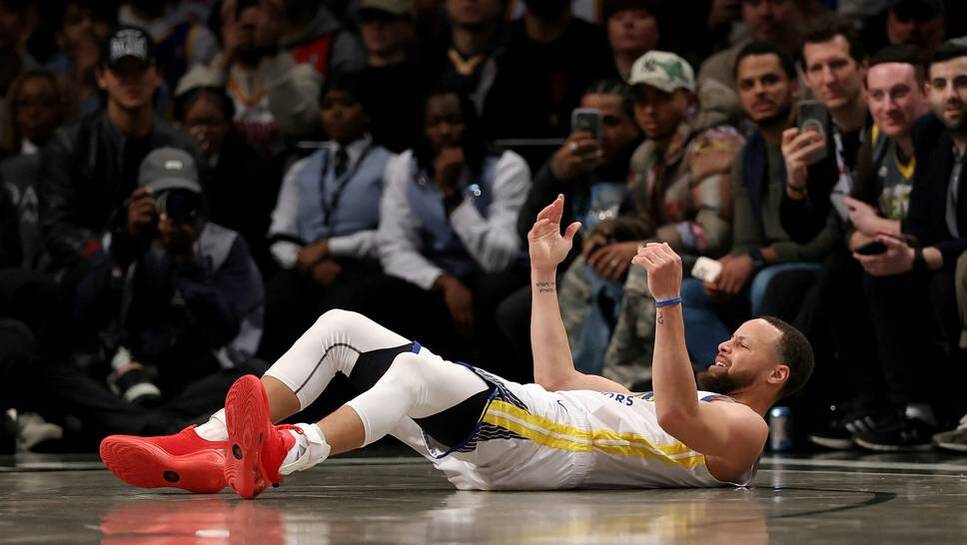 Curry lies on the ground