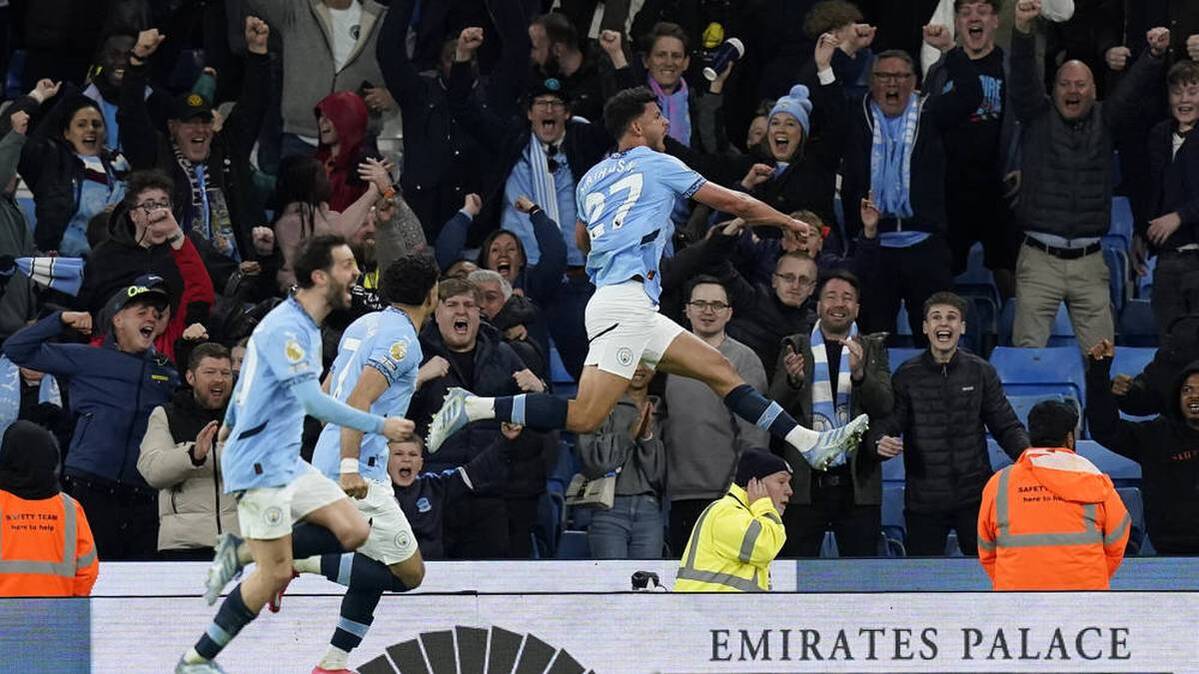 Matheus Nunes (right) met for Manchester City