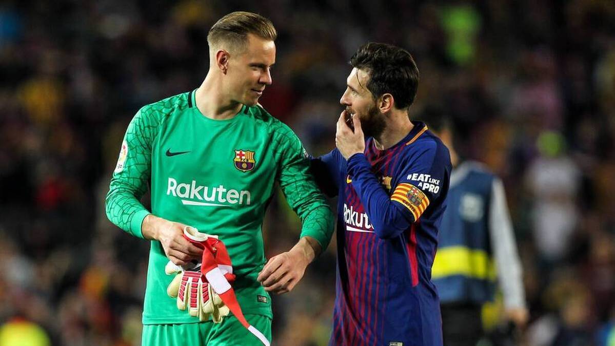 Marc-André Ter Stegen (left) next to Lionel Messi