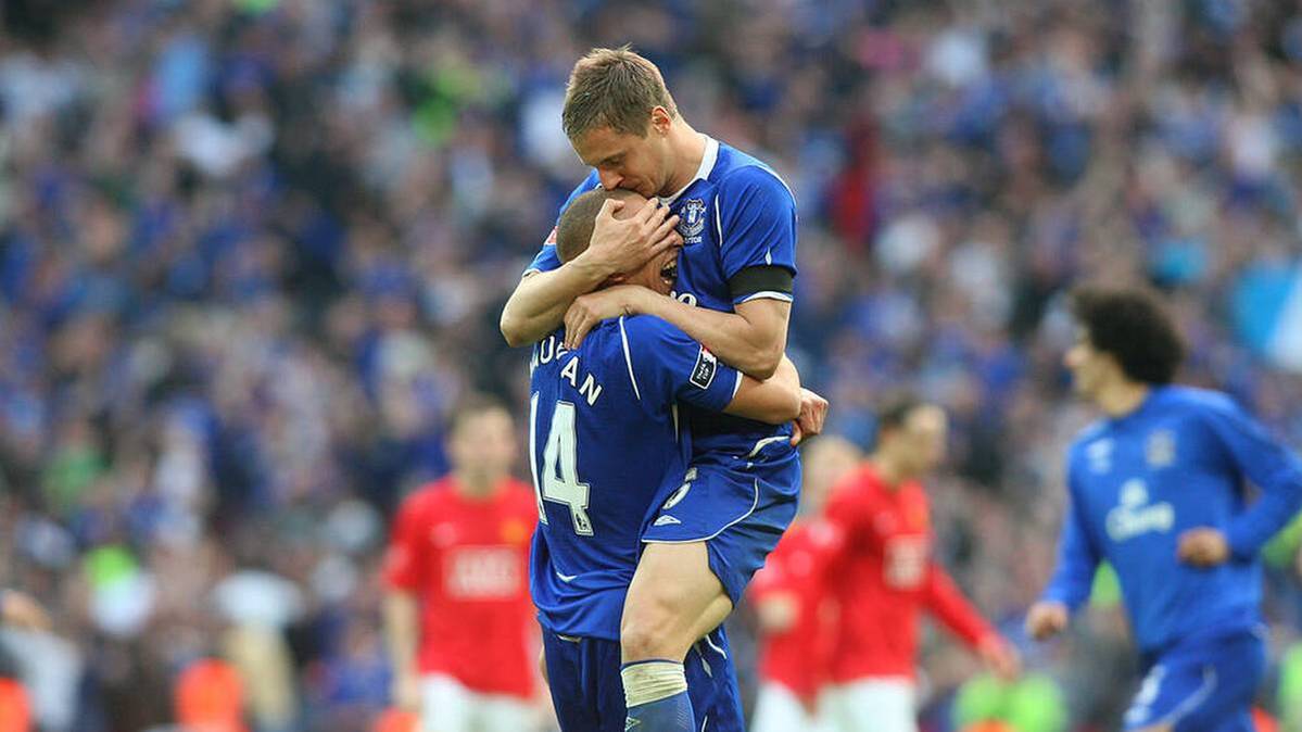 James Vaughan (left) and Phil Jagielka (right) cheer together for FC Everton