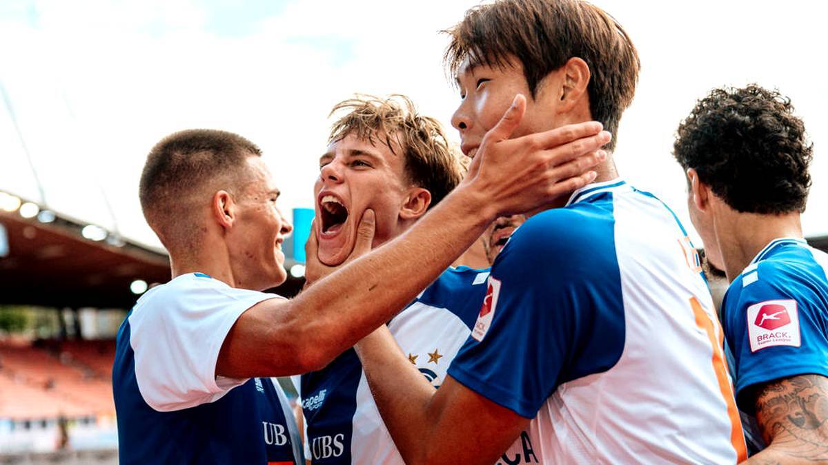 Jonathan Asp Jensen (center) being celebrated
